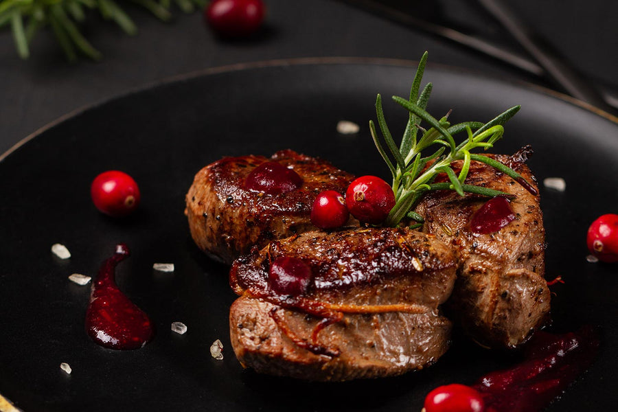 Venison with a cranberry red wine sauce